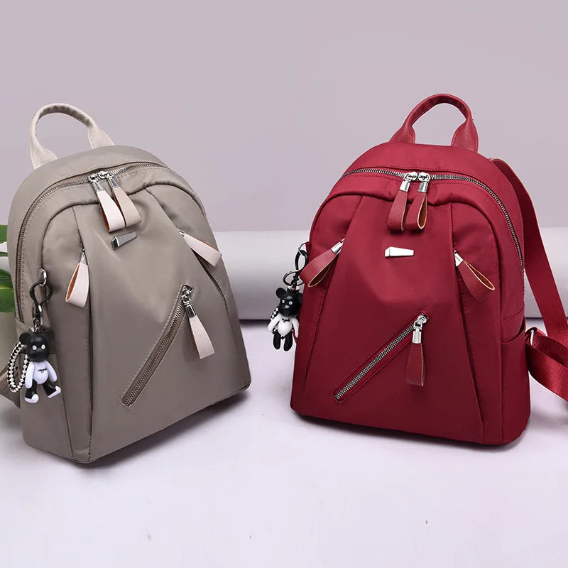 The new Oxford waterproof and wear-resistant travel backpack is simple, versatile and has a large capacity for women