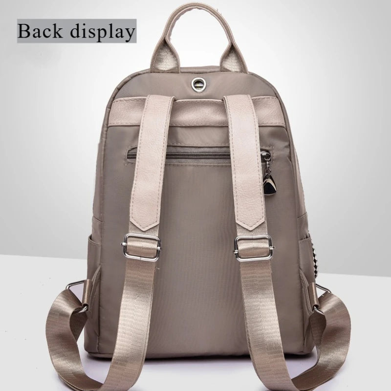 The new Oxford waterproof and wear-resistant travel backpack is simple, versatile and has a large capacity for women