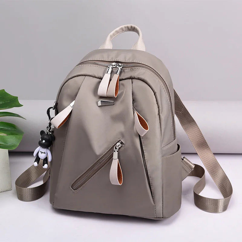 The new Oxford waterproof and wear-resistant travel backpack is simple, versatile and has a large capacity for women